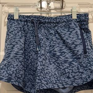 Girls Athleta shorts blue animal/water print. Size XL14